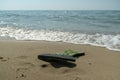 Pair, two of men`s beach slippers on the sand Royalty Free Stock Photo