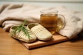 a pair of unworn slippers beside a cold cup of herbal tea Royalty Free Stock Photo