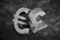 Pair of vintage pound and euro symbols