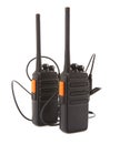 Pair of Walkie Talkie 2 way radios with headsets Royalty Free Stock Photo