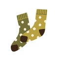 Pair of warm wool socks with polka dot pattern. Winter woolen feet clothes. Cute cozy cotton foot apparel. Trendy Royalty Free Stock Photo