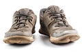 A pair of weared dirty sneakers isolated on white background, frontal vew Royalty Free Stock Photo