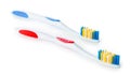 Pair of white blue and white red toothbrush isolated on white background, close up Royalty Free Stock Photo