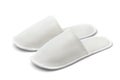 Pair of white disposable textile slippers
