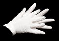 A pair of white gloves is shown in a close up Royalty Free Stock Photo