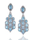 A pair of white gold earrings with diamonds and topazes