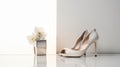 A pair of white high heels with a white flower box on a reflective surface. This image conveys a sense of elegance