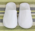 Pair of White hotel / home/ spa / wellness slippers Royalty Free Stock Photo