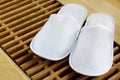 Pair of white hotel / home/ spa / wellness slippers Royalty Free Stock Photo