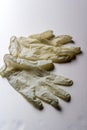 A pair of white latex gloves on white background, medical gloves close-up - Image