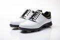 A pair of white leather golf shoes on a white background. Generated by artificial intelligence Royalty Free Stock Photo