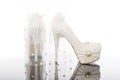 Pair of white pearls and lacy high pointed heels platform bridal shoes Royalty Free Stock Photo