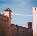 Pair of White Storks on a stick nest and ruined building of Badi palace in the medina of Marrakech Morocco, North Africa Royalty Free Stock Photo