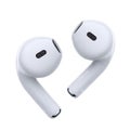 Pair of white wireless earbuds close-up studio shot of modern audio gadgets isolated on white background Royalty Free Stock Photo