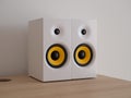 A pair of white wireless speakers on the desktop