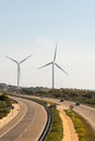 A pair of windmills in the Sierra del Merengue wind farm next to the Ruta de la Plata highway passing through Plasencia.
