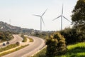 A pair of windmills in the Sierra del Merengue wind farm next to the Ruta de la Plata highway passing through Plasencia.