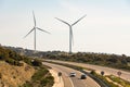 A pair of windmills in the Sierra del Merengue wind farm next to the Ruta de la Plata highway passing through Plasencia.