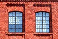 pair of Windows in red brick wall Royalty Free Stock Photo