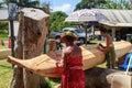 Women carving a ceremonial canoe, Rarotonga, Cook Islands