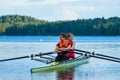 Pair of women rowing on the lake in Gothenburg, Sweden