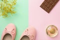 Pair of women`s girl`s ballerina pink pumps flats perfume flowers chocolate tablet on pastel