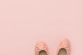 Pair of women`s girl`s ballerina pink pumps flats on same color background. Minimalist flat lay design template for collages