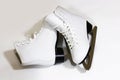 Pair of women`s white figure ice skates on white background Royalty Free Stock Photo