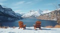 A pair of wooden chairs overlooking Waterton Lakes National Park Canada during the winter with a glacier lake