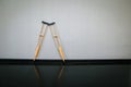 Pair wooden crutches or medical walking sticks for rehabilitation of broken leg.