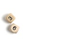 Pair of wooden dice for board games with numbers three and six white background.