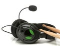 Pair of wooden drumsticks with Black Head phones.