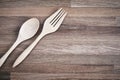 Wooden fork and spoon on the wooden floor with texture