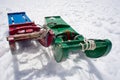 Pair of wooden sleds in the snow