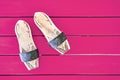 Pair of wooden Turkish bath clog on pink wooden table background