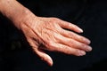 Pair of wrinkled hands of an elderly Chinese woman