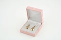 Pair of yellow gold earrings in a box