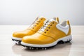 A pair of yellow leather golf shoes on a white background. Generated by artificial intelligence Royalty Free Stock Photo