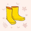 Pair of yellow rubber rain boots in doodle style. Symbol of autumn and wet weather. Vector doodle illustration isolated