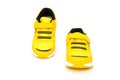 Pair of yellow sporty shoes for kid on white Royalty Free Stock Photo