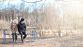 A pair of young people met in the park. Lovers are sitting on a Royalty Free Stock Photo