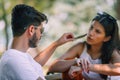 A pair of young people met in the park. Lovers are sitting on a bench Royalty Free Stock Photo