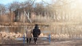 A pair of young people met in the park. Lovers are sitting on a Royalty Free Stock Photo