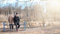 A pair of young people met in the park. Lovers are sitting on a Royalty Free Stock Photo