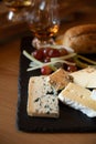 Pairing of scotch whisky and farmers scottish cheeses cheddar, stilton, blue cheese, brie, tasting of whiskey and cheese in
