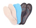 Pairs of different insoles on background, top view