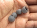 Two pairs of earphone pads on palm of hand