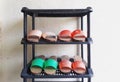 Pairs of home-made traditional wooden shoes on the shoe rack. Royalty Free Stock Photo