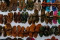 Pairs of Rajasthani colorful mens` and womens` shoes, at display for sale. Jaisalmer, Rajasthan, India Royalty Free Stock Photo