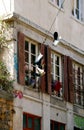 Pairs of sneakers hanging by street gangs from power lines on the streets of an Lyon city.